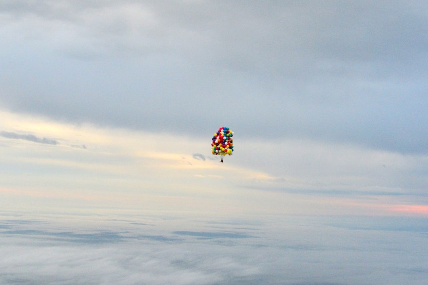 Jonathan Trappe is surrounded by balloons that will he will use to float across the Atlantic Ocean from Caribou, Maine.