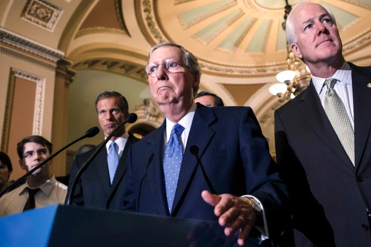 Senate Minority Leader Mitch McConnell and a clutch of Senate Republicans address the media over the budget battle Friday on Capitol Hill.