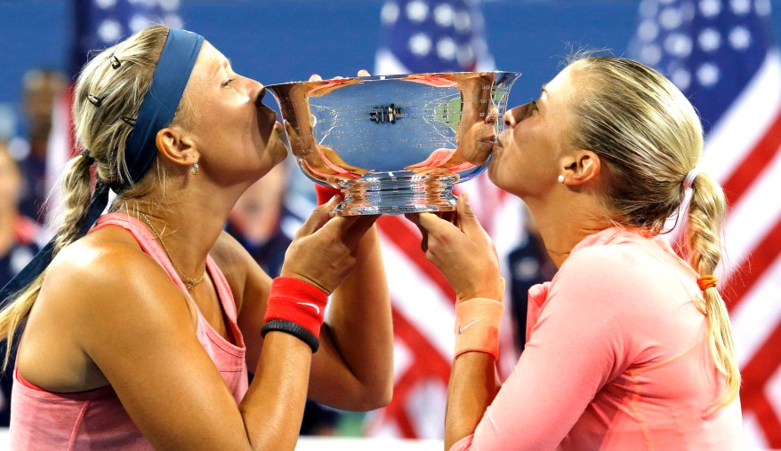 Andrea Hlavackova and Lucie Hradecka puckered up to celebrate their doubles title.