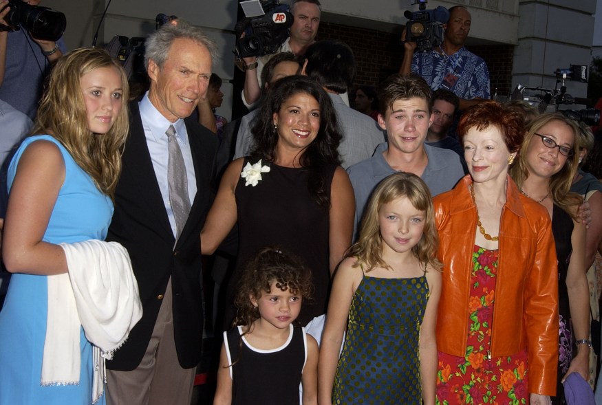 Clint (back row L), Dina (back row C) and Scott Eastwood (back row R), with the rest of the family