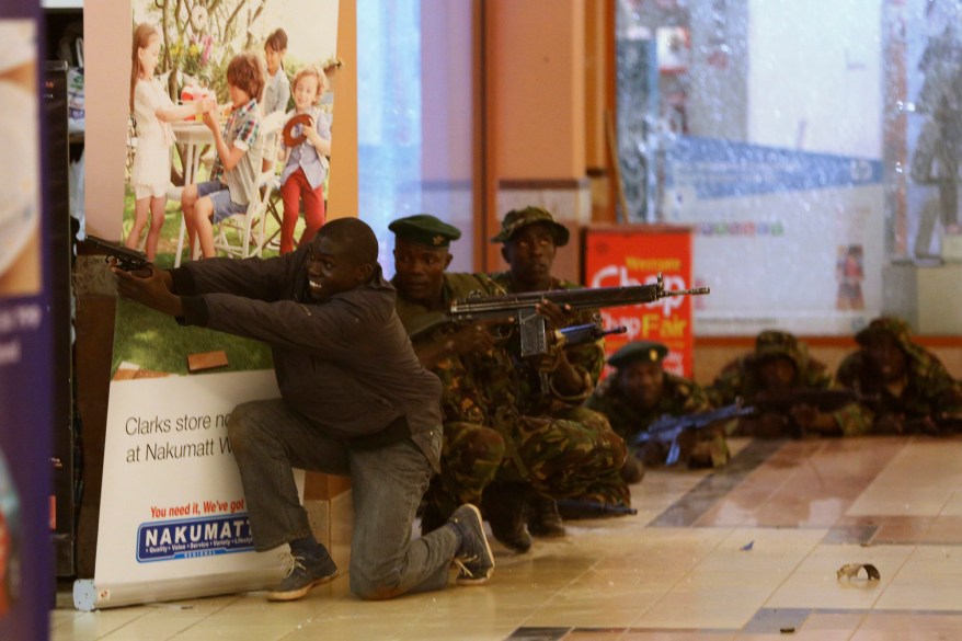 Soldiers and armed police hunt gunmen who went on a shooting spree in Westgate shopping centre in Nairobi