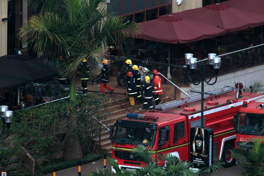 Firefighters enter Westgate shopping center after the explosions.