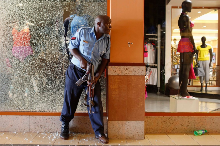 A police officer tries to secure an area inside the Westgate Shopping Centre where gunmen went on a shooting spree in Nairobi