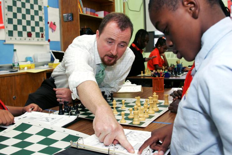 Sean O'Hanlon teaches chess at Eva Moskowitz's Harlem Success Academy charter school.