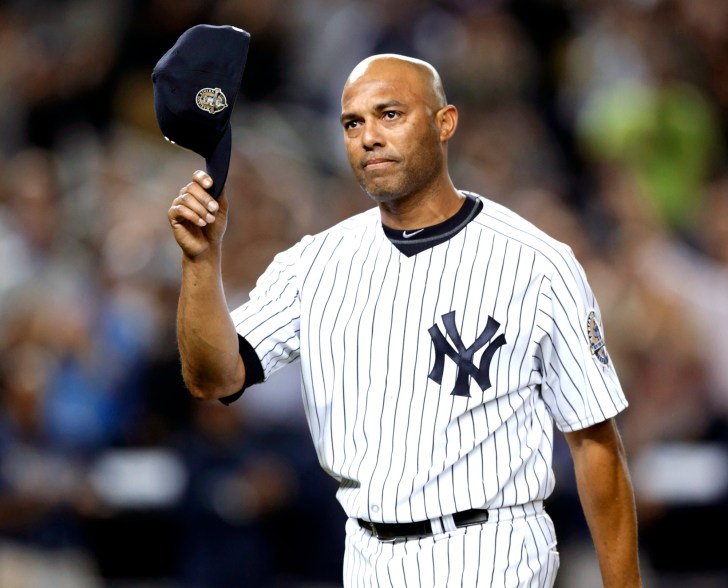 Mariano Rivera tips his hat to the Yankee Stadium crowd.