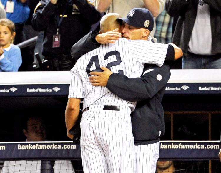 Mariano Rivera hugs Joe Girardi after coming out of the game.