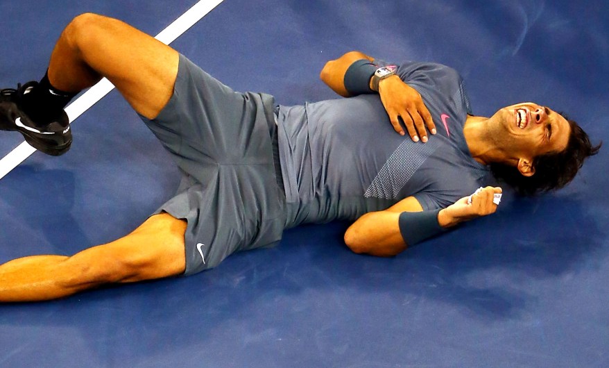 Rafael Nadal is overcome with emotion (or laughter? pain?) after winning the U.S. Open Monday night for the second time.