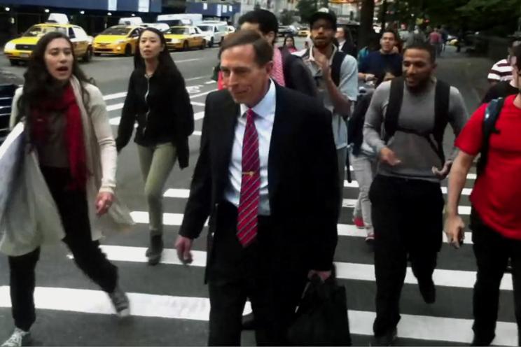 This screen grab shows students hounding retired Gen. David Petraeus after a CUNY class Wednesday.