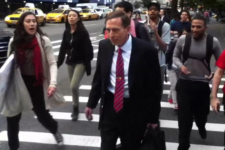 David Petraeus being harassed by an angry mob after leaving his class at CUNY.