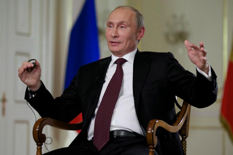 Russian President Vladimir Putin gestures while speaking to John Daniszewski, the Associated Press's Senior Managing Editor for International News