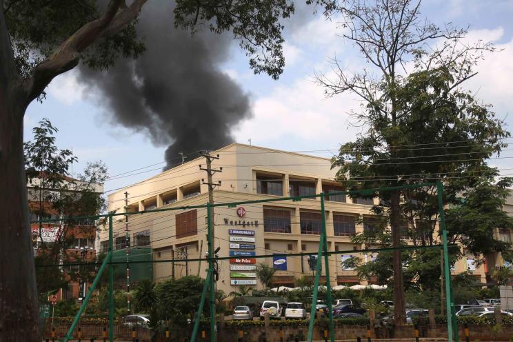 Smoke rises over Westgate shopping centre after an explosion in Nairobi, Kenya on September 23, 2013