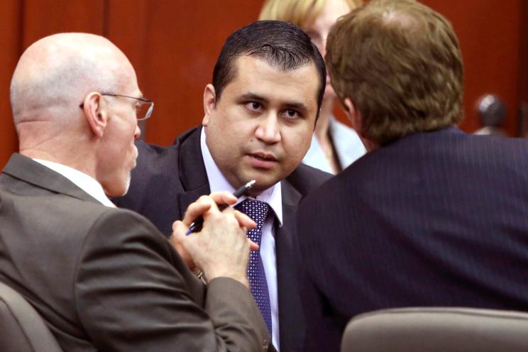 George Zimmerman, center, talks to his attorneys Don West, left, and Mark O'Mara