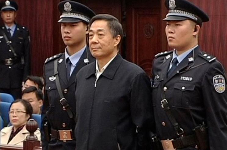 Bo Xilai, center, stands as the decision of his appeal is announced.