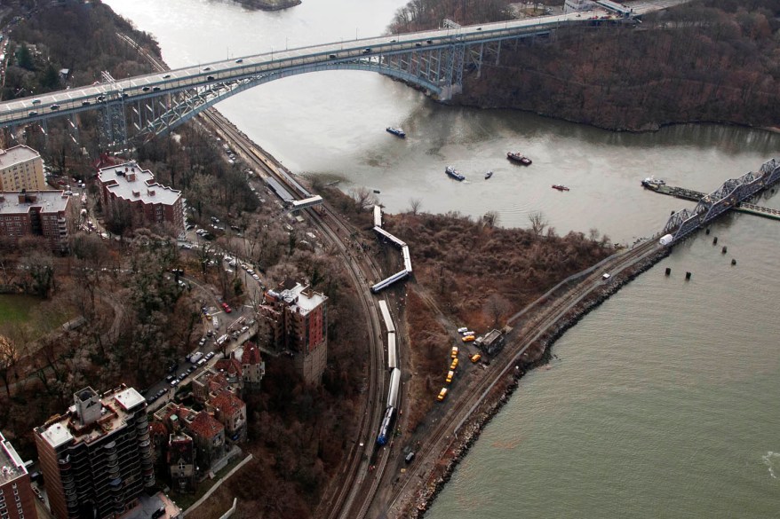 A Metro-North train lays on it's side after derailing in The Bronx.