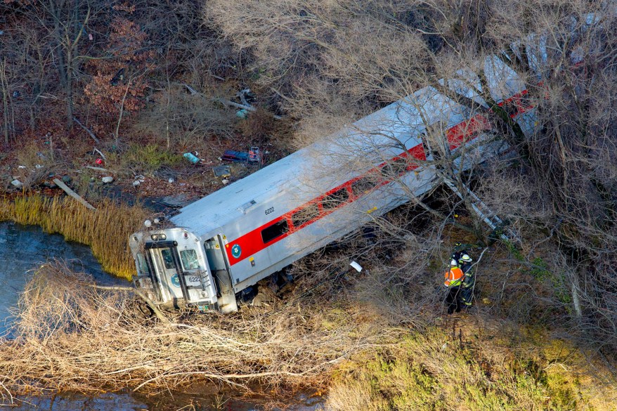 First responders view the derailment.