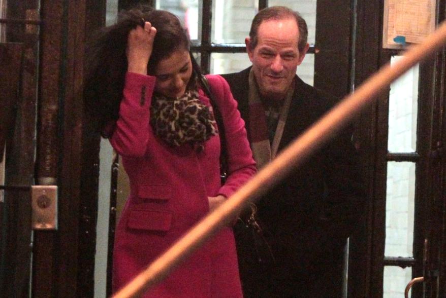 Lis Smith leaves her apartment with Eliot Spitzer at 10:47 on Dec. 19.