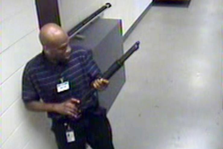 FBI surveillance video shows Aaron Alexis moving through the Washington Navy Yard carrying a shotgun.