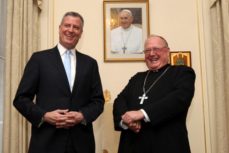 Bill de Blasio stands with Timothy Dolan.