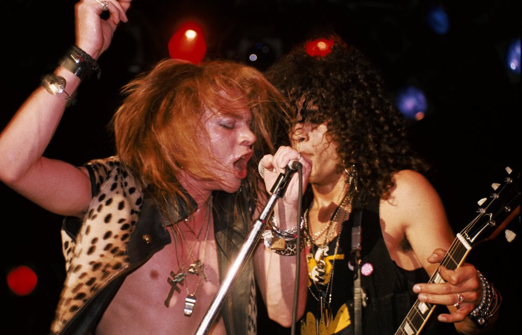 LOS ANGELES - JANUARY 4:  (L-R) Axl Rose and Slash of the rock band 'Guns n' Roses' perform onstage at the Troubadour where they played 'My Michelle' for the first time on January 4, 1986 in Los Angeles, California. (Photo by Marc S Canter/Michael Ochs Archives/Getty Images)