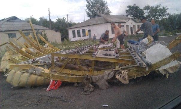 People walk through what appears to be the airplane's interior.