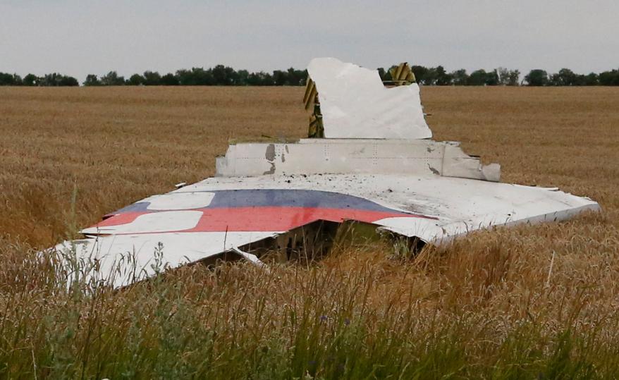 People walk through what appears to be the airplane's interior.