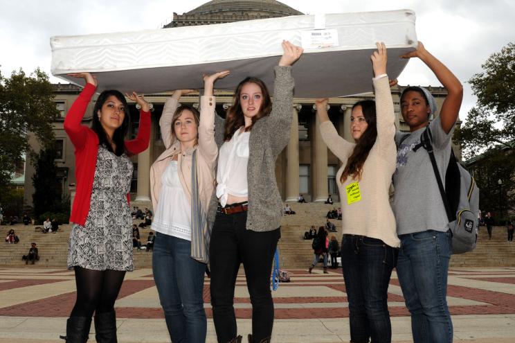 Columbia University students carry a mattress around campus in support of Emma Sulkowicz.