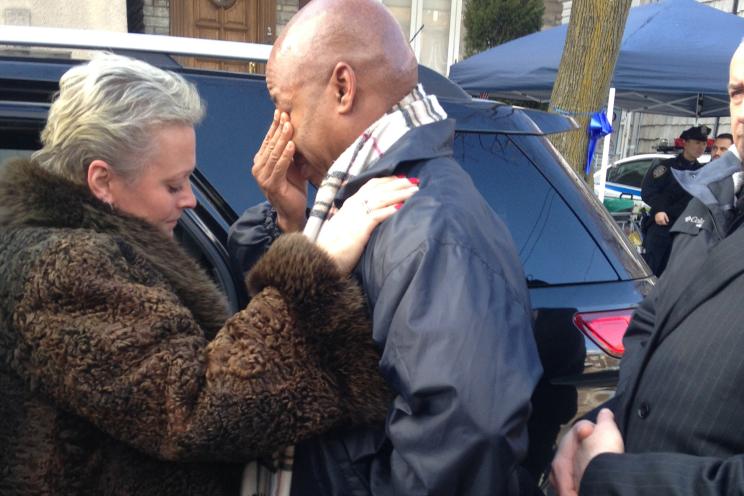 Tatyana Timoshenko comforts Brooklyn Borough President Eric Adams after his visit with fallen Officer Liu's family Wednesday.