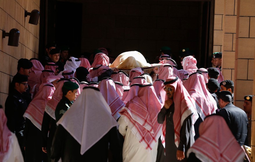 The body of Saudi King Abdullah bin Abdul Aziz is carried during his funeral at Imam Turki Bin Abdullah Grand Mosque, in Riyadh January 23, 2015. Saudi Arabia's Interior Minister, Prince Mohammed bin Nayef, a close friend of the United States and a scourge of Islamist militants, will be the country's first king from the third generation of its ruling dynasty. King Salman moved swiftly to appoint Mohammed Deputy Crown Prince on Friday, hours after he took the throne following the death of King Abdullah. The decision appeared to settle for many years to come tough decisions over the kingdom's future succession. REUTERS/Faisal Al Nasser (SAUDI ARABIA - Tags: ROYALS RELIGION OBITUARY TPX IMAGES OF THE DAY)