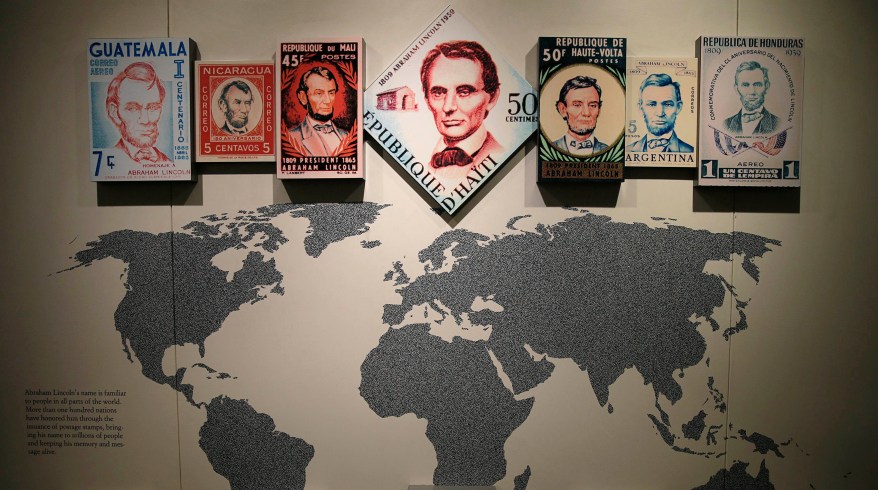 Various global stamps with Lincoln's image are displayed in the visitor center at the Lincoln Memorial in Washington.