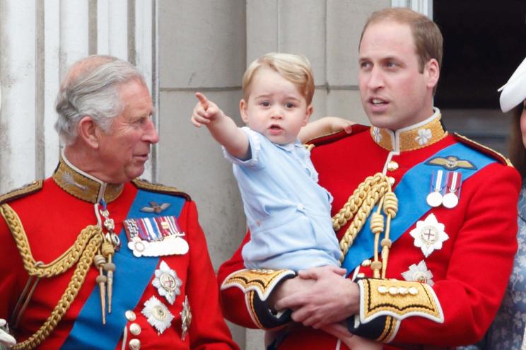 Prince Charles, Prince William and Prince George stand on the balcony of Buckingham Palace during Trooping the Colour on June 13.