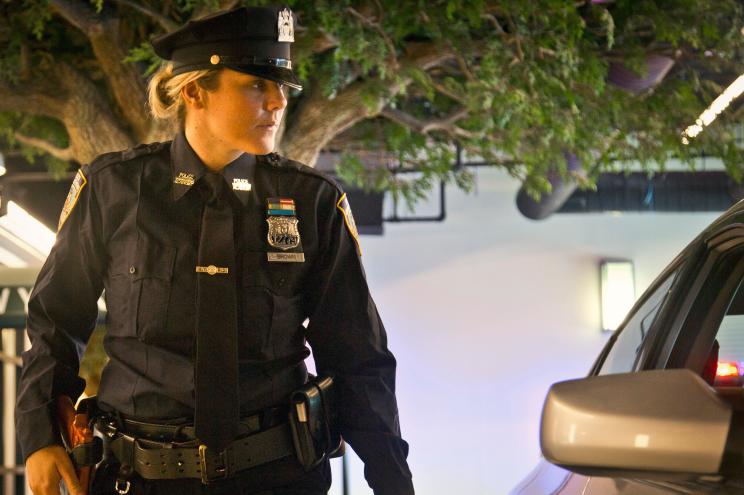 Officer Melissa Brown observes a suspected drunk driver in the staging of a car stop during a training demonstration in 2015.