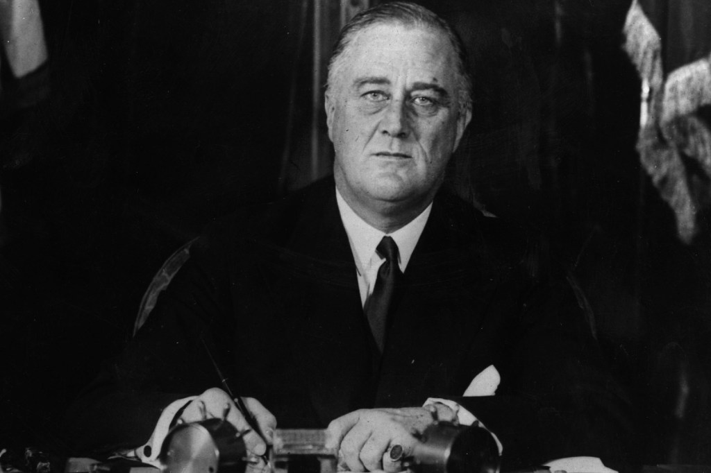 circa 1940:  American President Franklin Delano Roosevelt (1882 - 1945) at his desk.  (Photo by Hulton Archive/Getty Images)