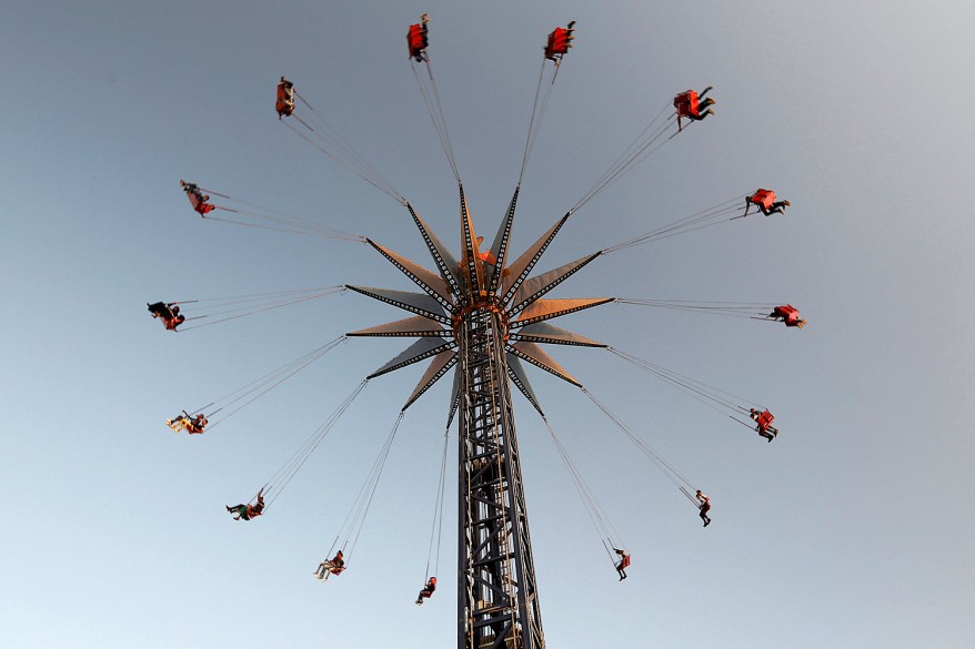 People take a ride at an amusement park as they celebrate the Muslim festival of Eid al-Adha in Baghdad.