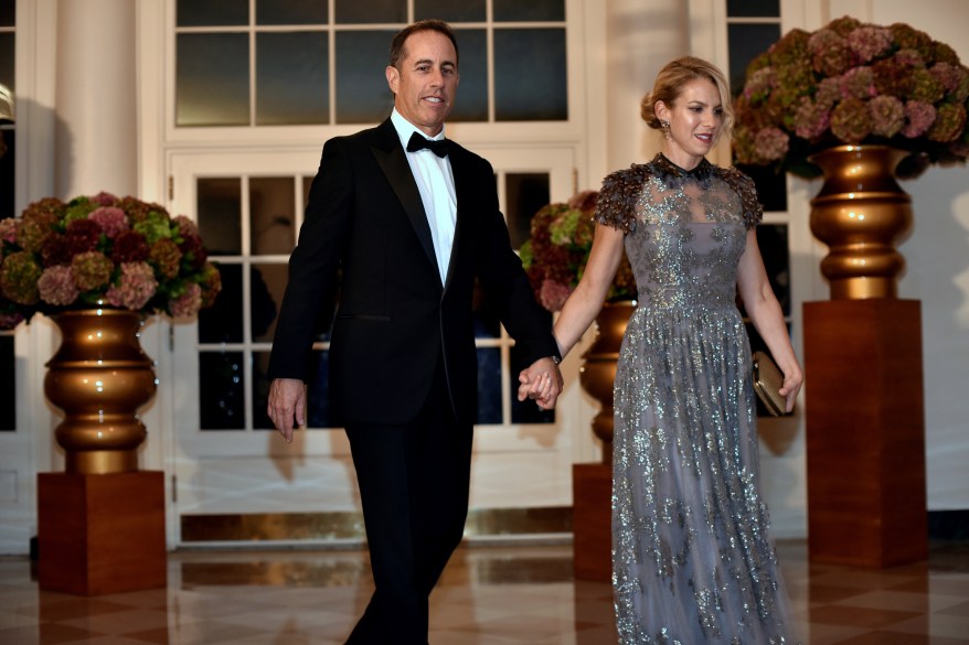 Comedian Jerry Seinfeld (L) and Jessica Seinfeld (R) arrive for a State Dinner honoring Italian Prime Minister Matteo Renzi at the White House in Washington