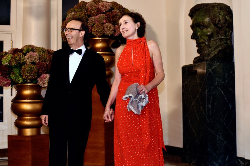 Roberto Benigni (L) and Nicoletta Braschi (R) arrive for a State Dinner honoring Italian Prime Minister Matteo Renzi at the White House in Washington