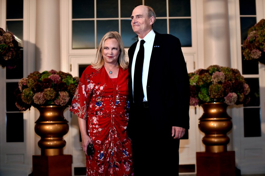 Singer and songwriter James Taylor (R) and Kim Taylor (L) arrive for a State Dinner honoring Italian Prime Minister Matteo Renzi at the White House in Washington