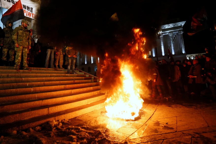 Activists burn tires in Independence Square to mark the anniversary of the 2014 Ukrainian pro-European Union mass protests on the Day of Dignity and Freedom in central Kiev, Ukraine.