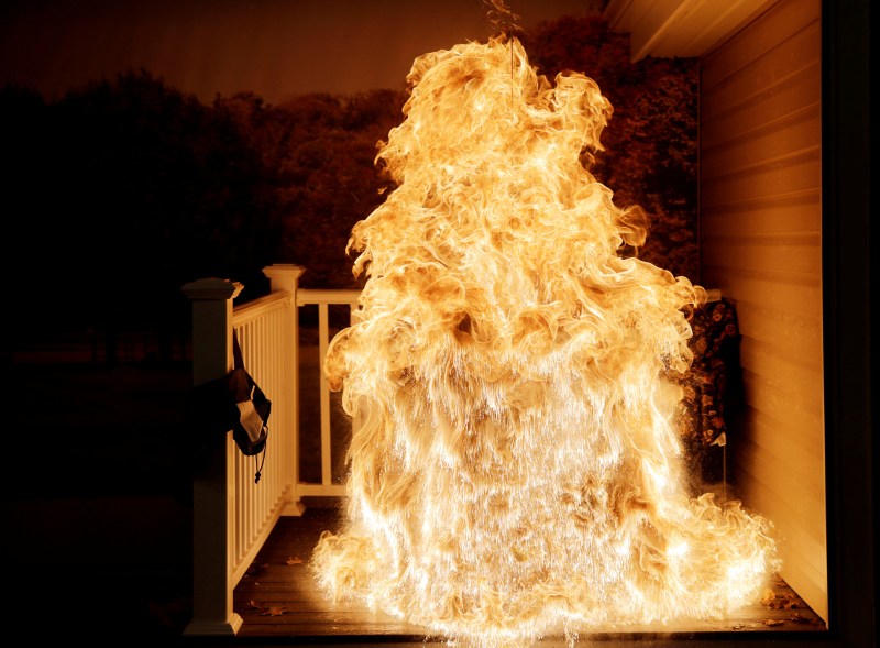 A frozen turkey is dropped into a hot deep fryer and creates a large fireball at a Consumer Product Safety Commission Thanksgiving fire and food safety demonstration of holiday kitchen fires in Rockville, Maryland.