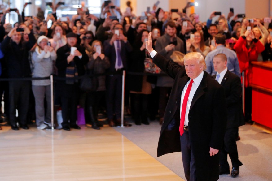 Donald Trump greets a crowd at Trump Tower in Midtown.