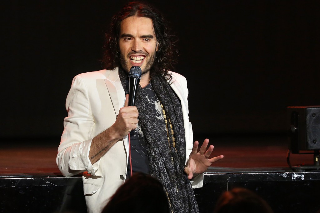 BERLIN, GERMANY - FEBRUARY 10:  British Comedian Russell Brand steps out into the audience while performing his stand-up comedy show 'Messiah Complex' at Admiralspalast on February 10, 2014 in Berlin, Germany.  (Photo by Adam Berry/Getty Images)