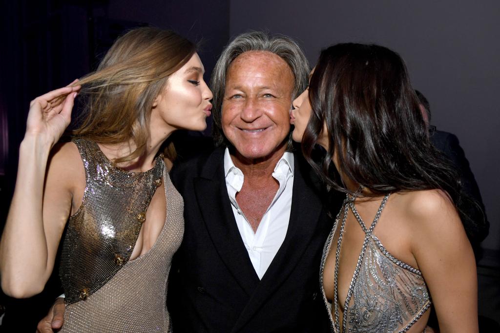 Gigi Hadid, Mohamed Hadid and Bella Hadid attend the Victoria's Secret After Party at the Grand Palais on November 30, 2016 in Paris, France.