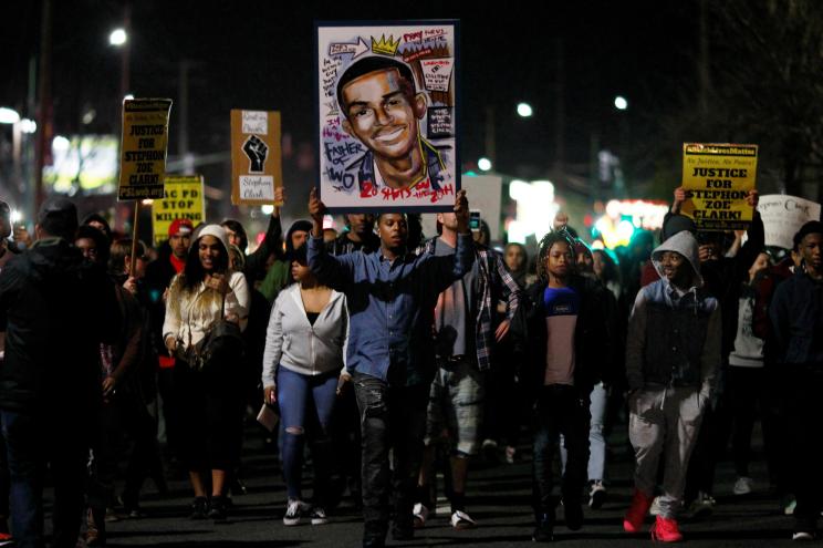 Demonstrators march to protest the police shooting of Stephon Clark, in Sacramento, California.