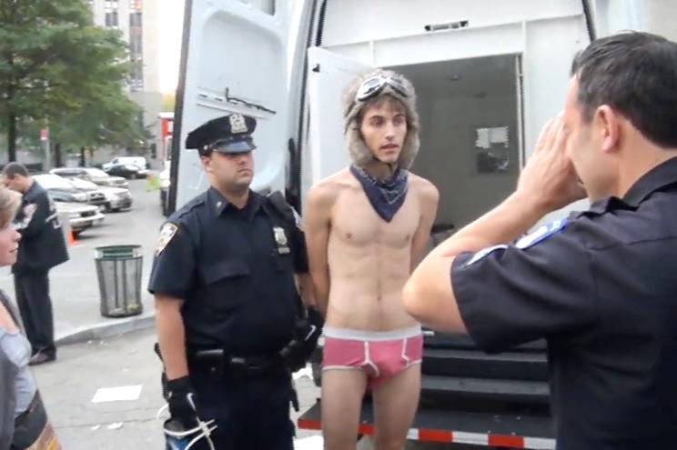 `Kalan Sherrard (in pink underwear) being arrested by Howard Redmond