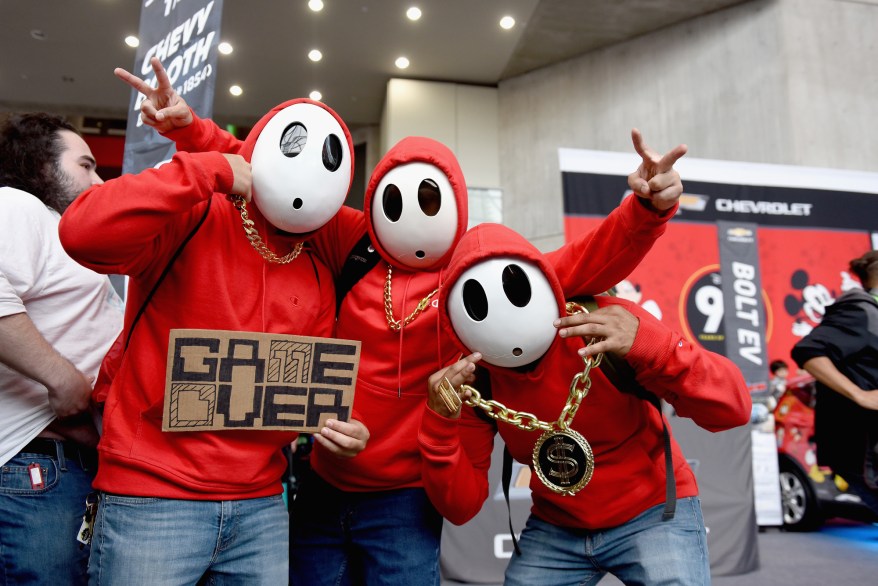 Fans cosplay as Shy Guy from Mario Bros. video game series.