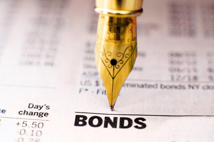 A pen signs a bond agreement