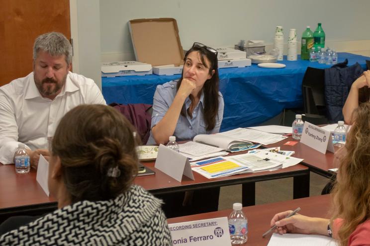 Camille Casaretti listens as Representatives of the Dept of Eduction present their diversity plan for specialized high schools.