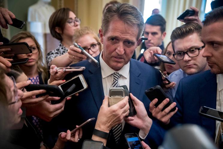 Jeff Flake speaks with reporters after a meeting with Mitch McConnell in September.