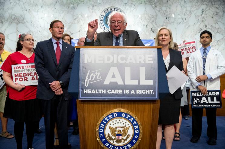 Sen. Bernie Sanders, I-Vt., center, joined by Sen. Richard Blumenthal, D-Conn., center left, Sen. Kirsten Gillibrand, D-N.Y., center right, and supporters, speaks at a news conference on Capitol Hill.