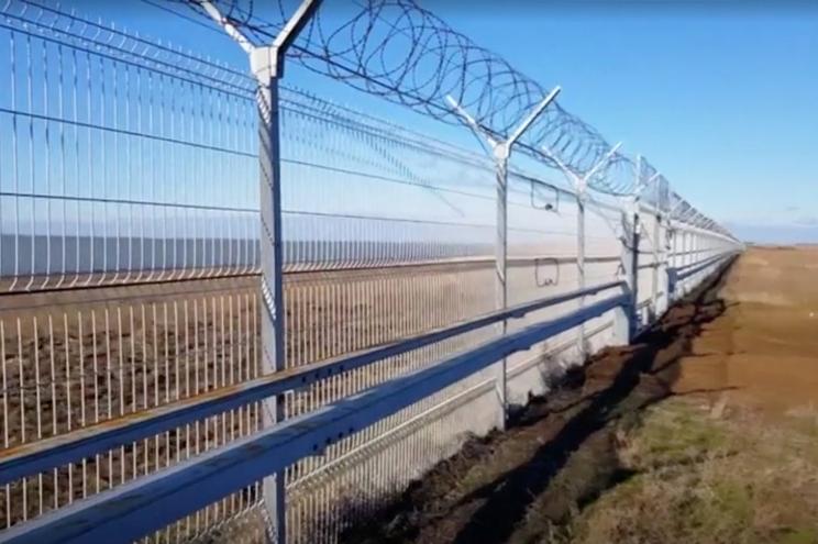 A still image taken from a video footage shows a 60-kilometre fence separating Crimea peninsula from continental Ukraine.