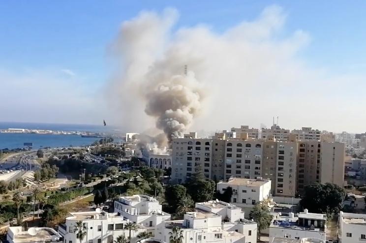 Smoke rises from the Libyan foreign ministry building in Tripoli, Libya.